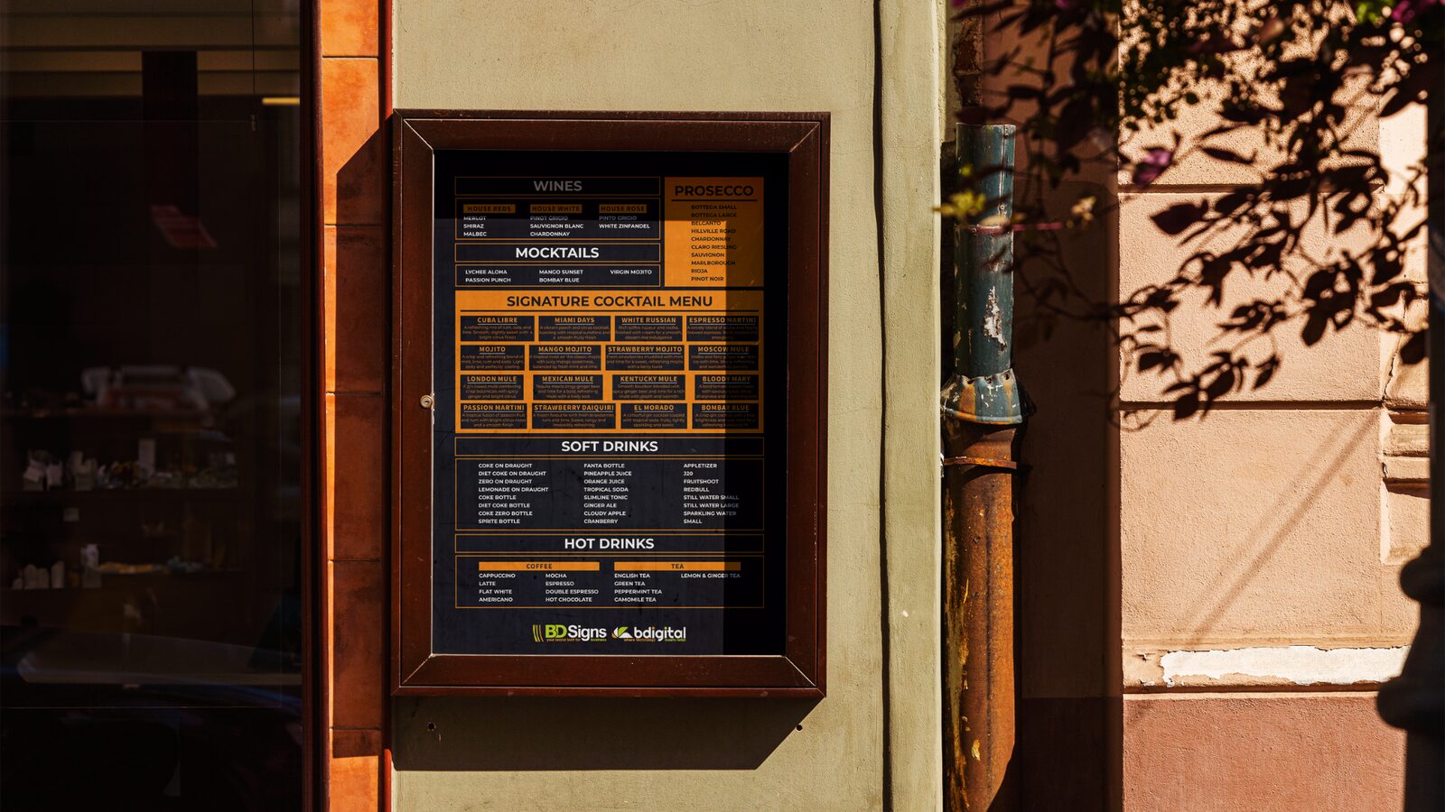 Framed drinks menu on the wall of a bar