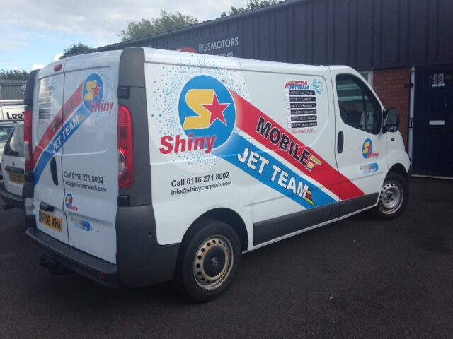 Jet washing company van with printed side livery